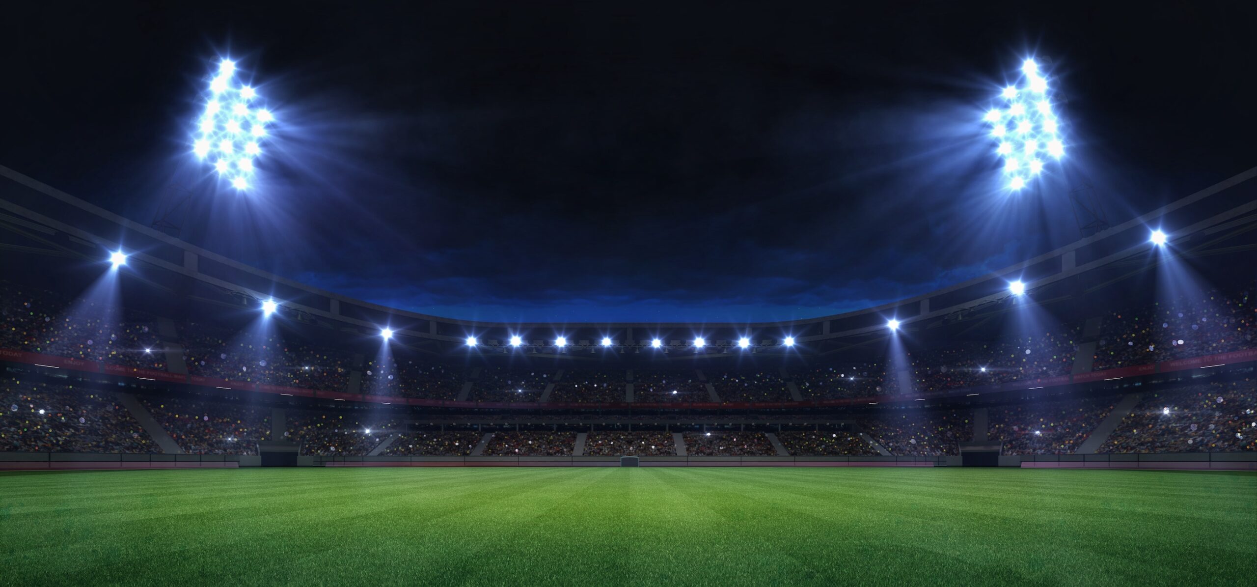 universal grass field stadium illuminated by spotlights