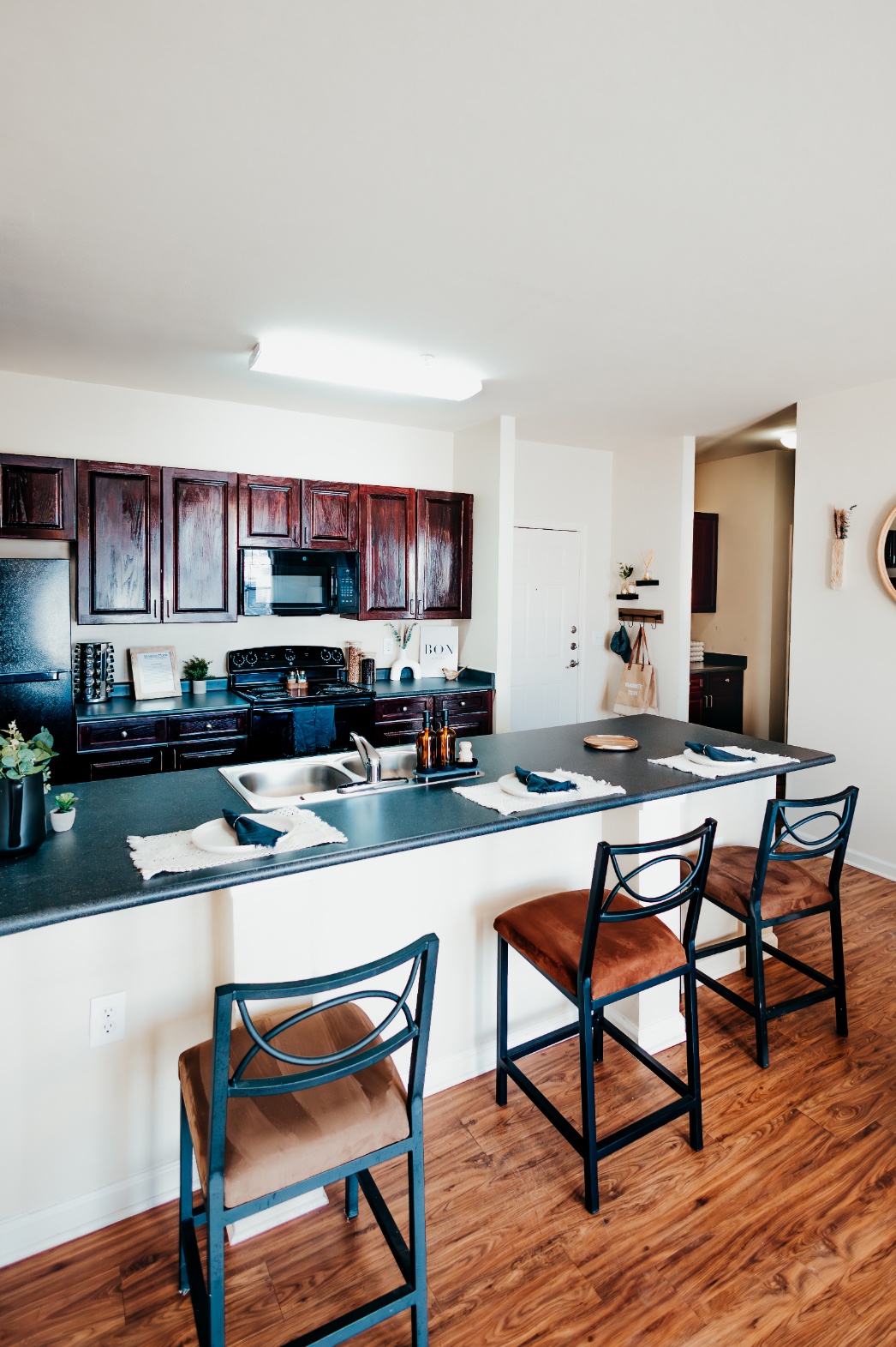Breakfast bar seating in a model kitchen at Maverick Place
