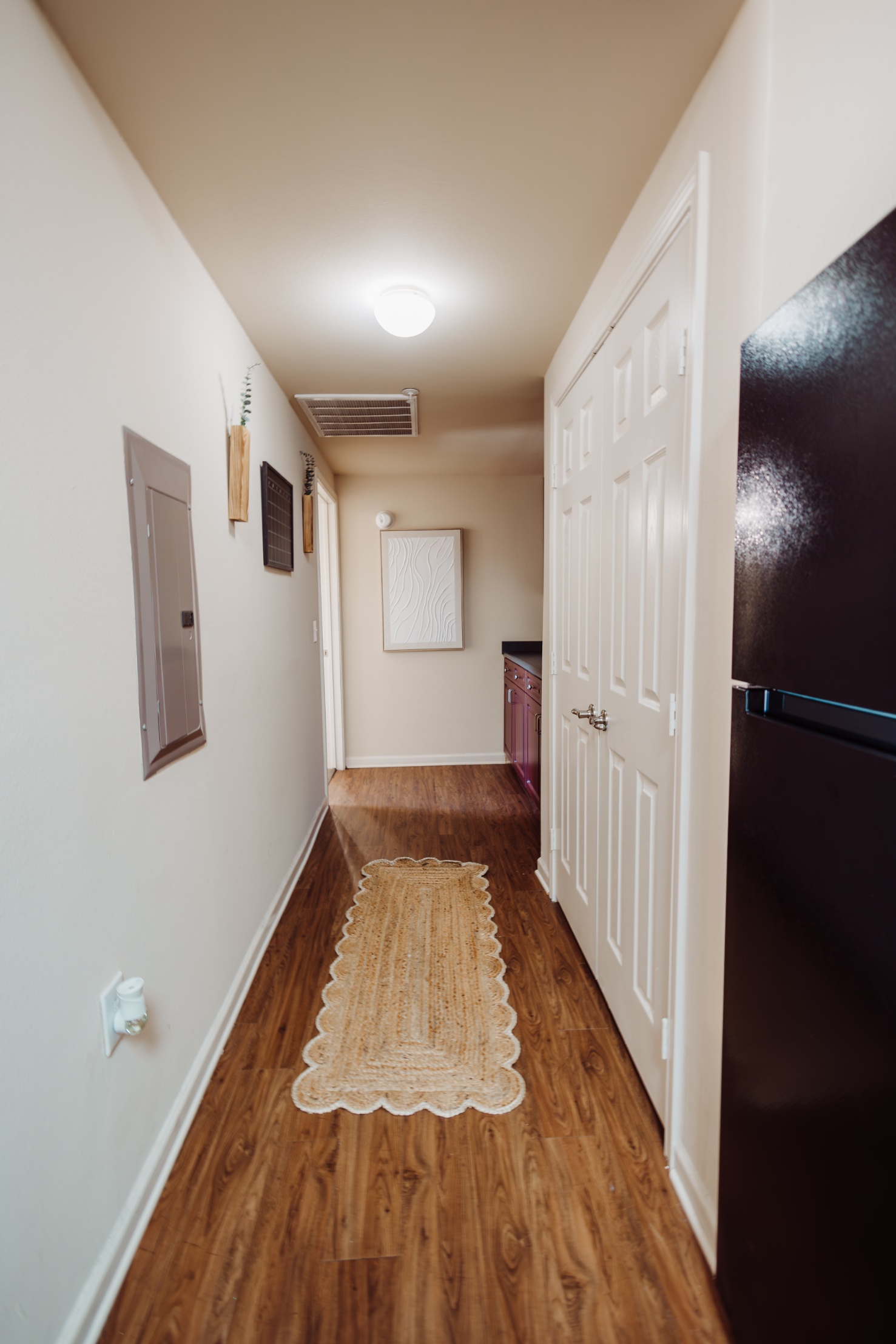 Laundry and hallway of a model unit at Maverick Place