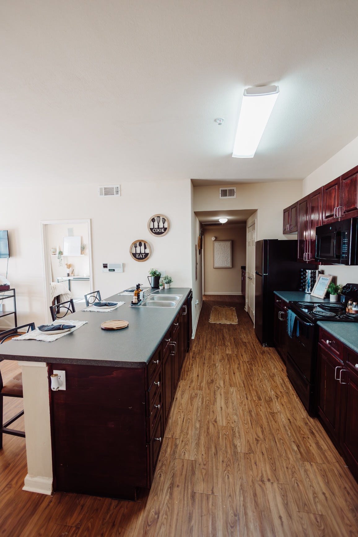 Open model kitchen with breakfast bar at Maverick Place Open model kitchen with breakfast bar at Maverick Place