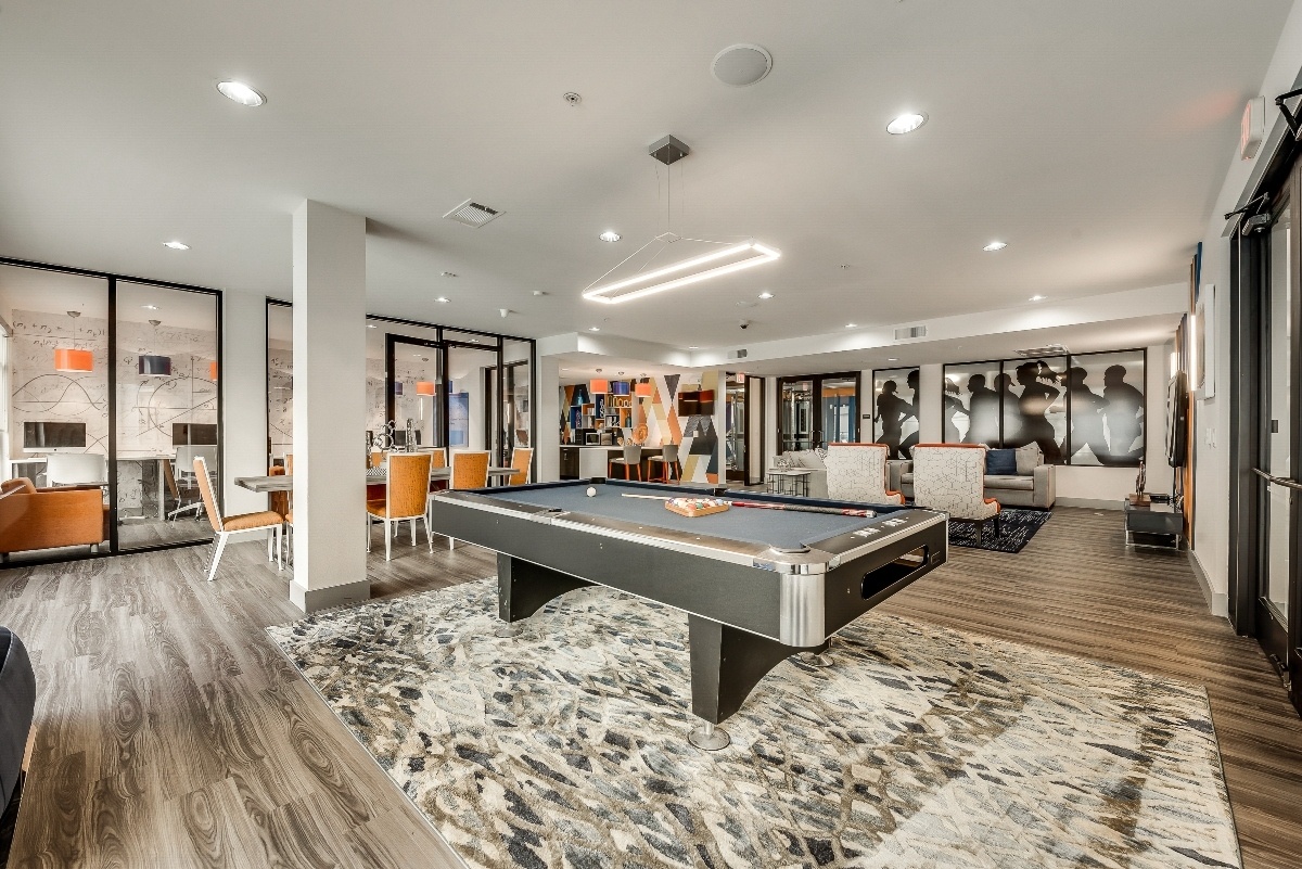 Resident clubhouse with a pool table at Maverick Place Resident clubhouse with a pool table at Maverick Place