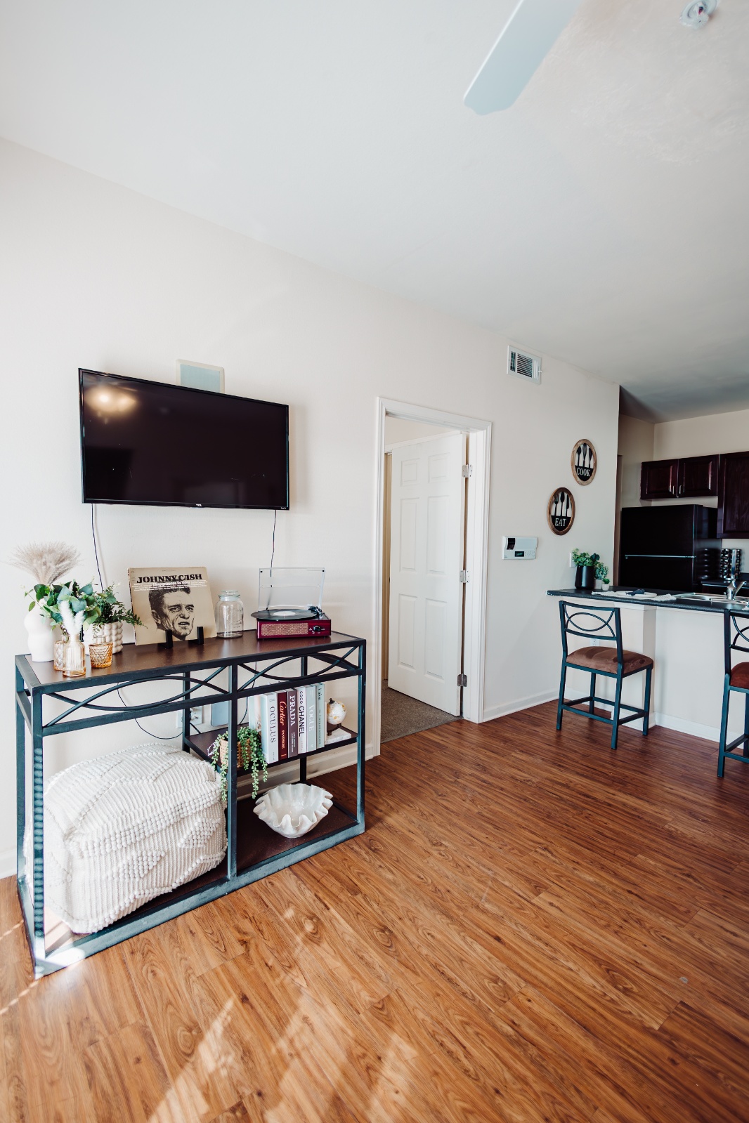 TV in the living room of a fully furnished apartment at Maverick Place